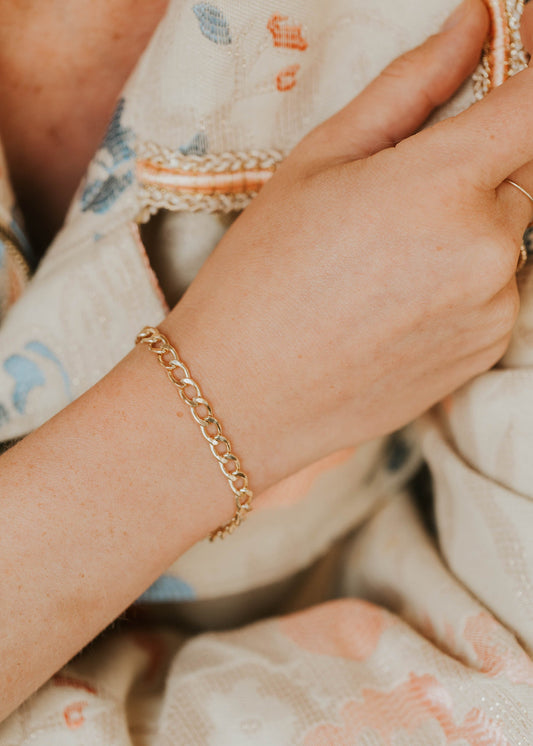 Model wearing free people jacket with dylan bracelet