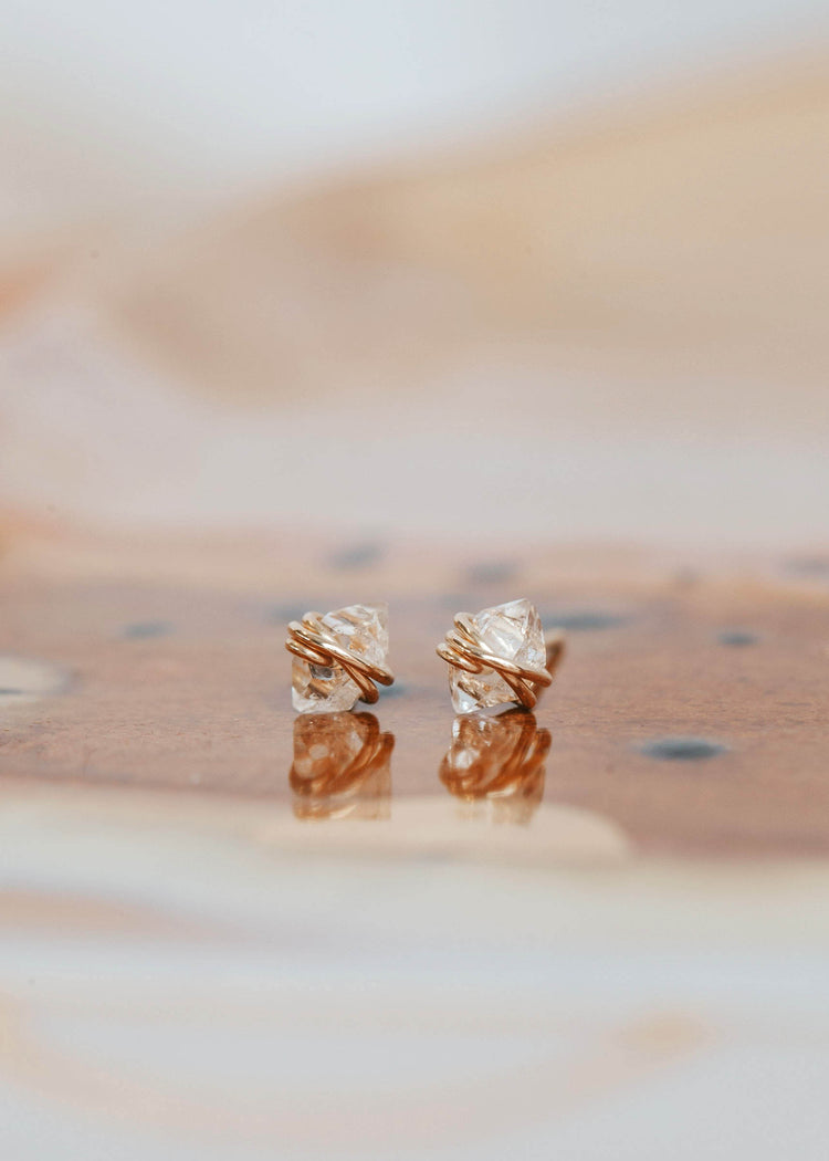 Handmade jewelry using herkimer diamonds shown in 14k gold fill to create diamond quartz stud earrings by Hello Adorn.
