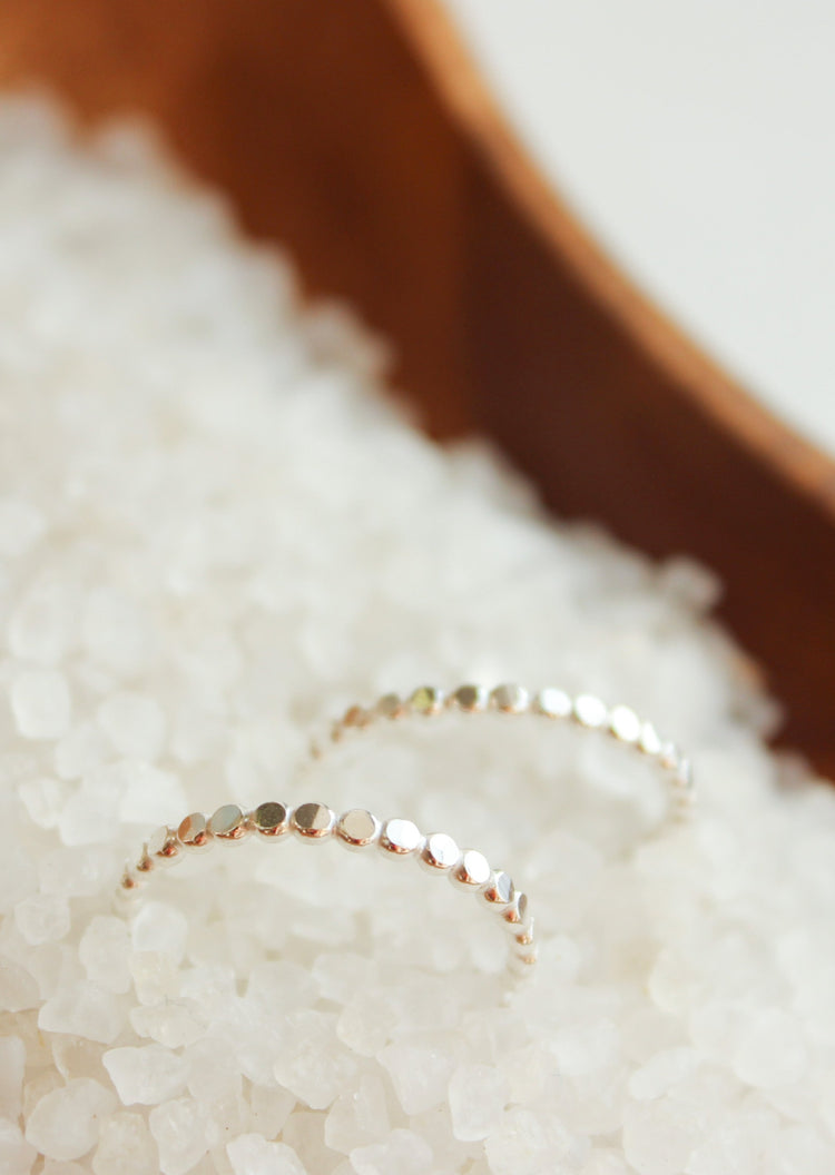 Silver stacking rings with hammered ring look in tiny dot confetti band style by Hello Adorn.