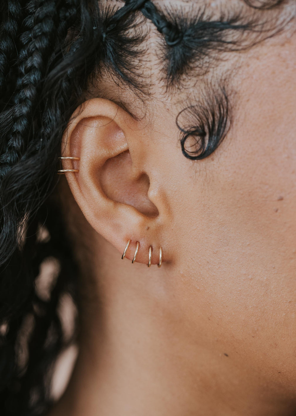 Close-up of tiny twist earrings