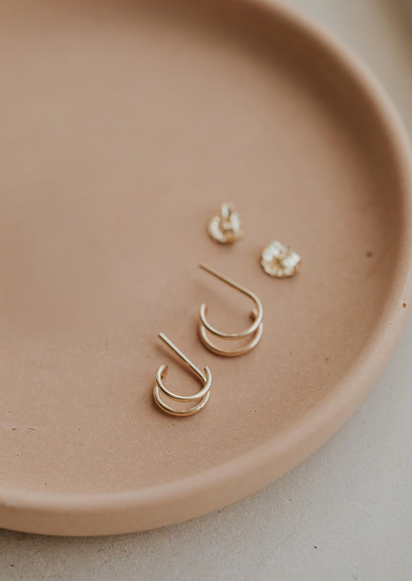 Double twist earrings by Hello Adorn in double up post style shown in 14k gold fill.