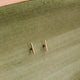 Small earrings in 14k gold fill in tiny bar stud style by Hello Adorn.