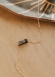 A black stone necklace created by Hello Adorn, a gemstone attached to a gold dainty chain to create the Gemma necklace.