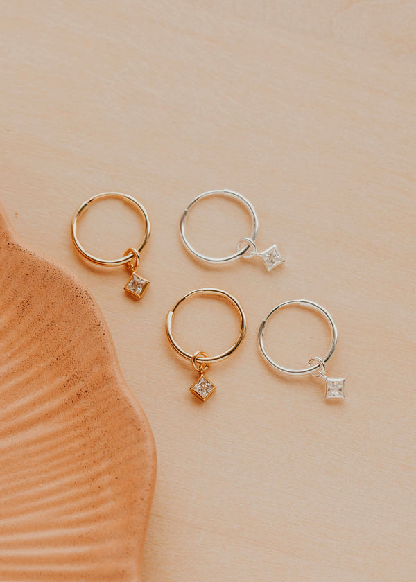 14K Gold Fill and Sterling Silver Grace Hoops by Hello Adorn - both metal options with CZ charms displayed