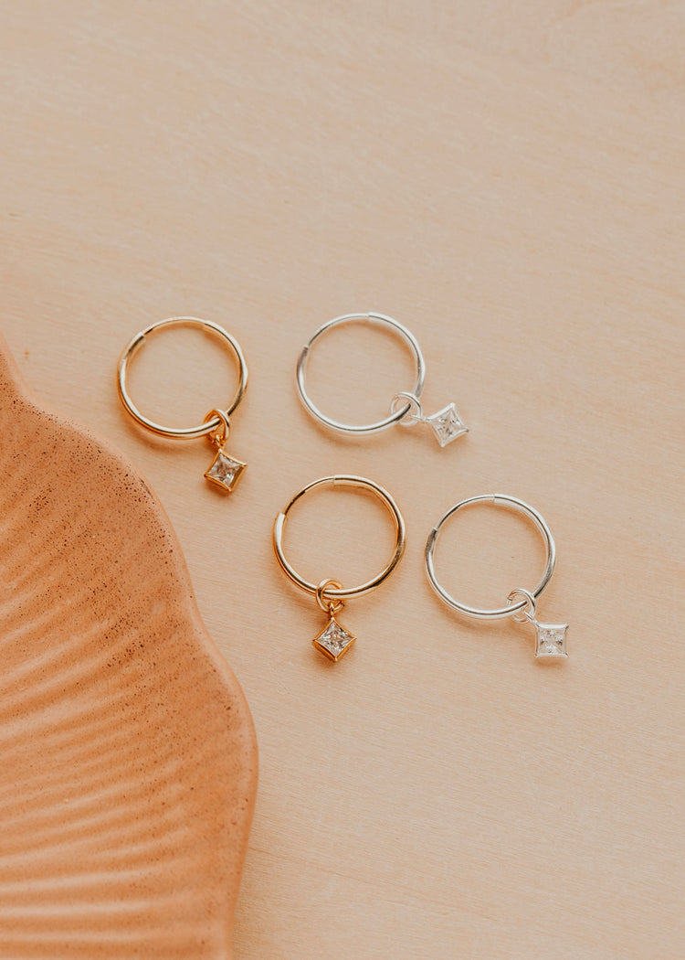 14K Gold Fill and Sterling Silver Grace Hoops by Hello Adorn - both metal options with CZ charms displayed