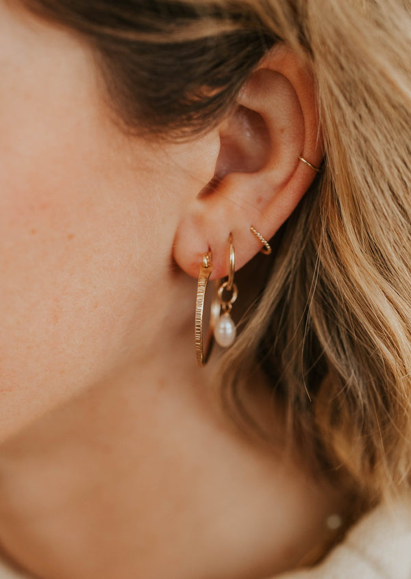 marlo textured hoop earrings ear stack on model