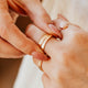 14K Gold Fill Classic Initial Band by Hello Adorn - two stacked gold bands engraved with initials on model's finger