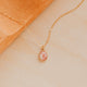 14K Gold Fill Rosalie Necklace by Hello Adorn - oval pink stone pendant on delicate chain against terracotta prop