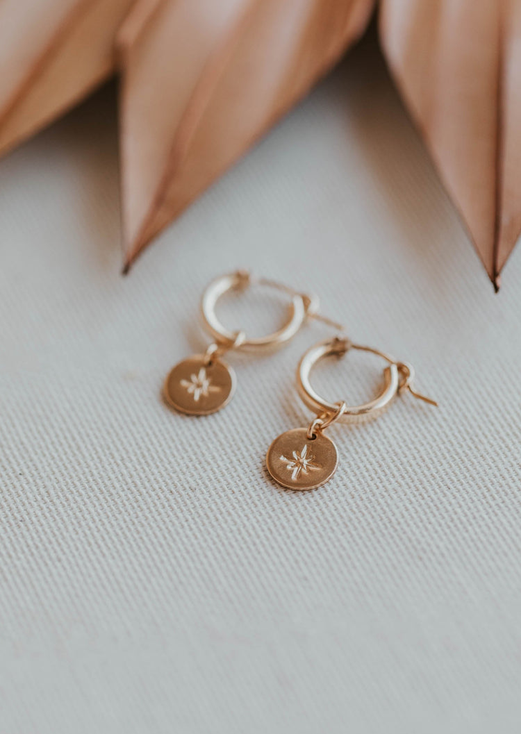 gold flatlay hoop earrings with stamped charm hoop