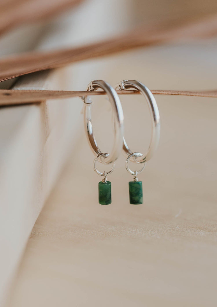 silver hoop earring with gemstones