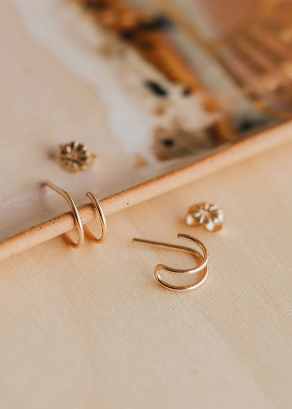 Spiral hoop twist double earrings shown in 14k gold fill by Hello Adorn.