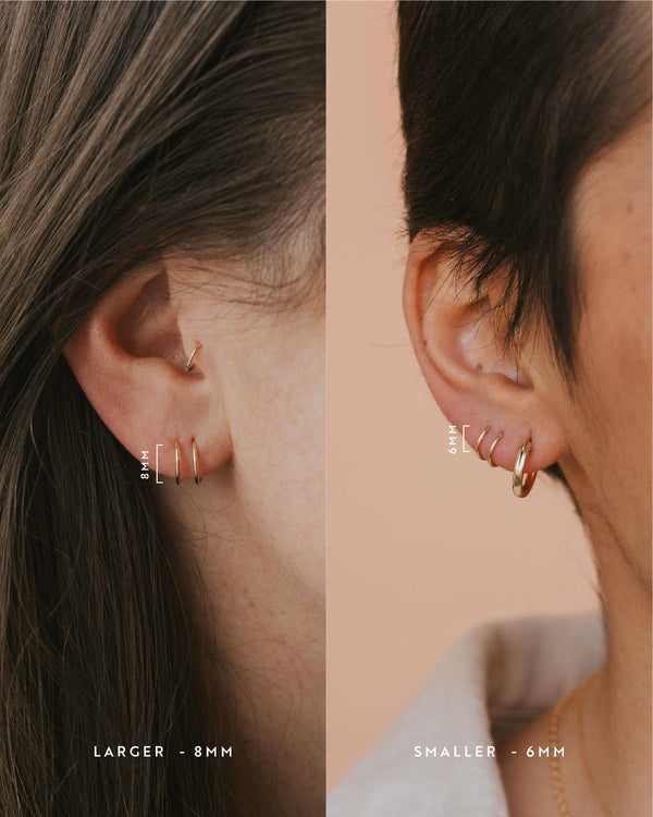 Tiny Twist Earrings shown in an ear in larger size of 8MM and smaller size 6MM paired with a Bold Hoop by Hello Adorn.