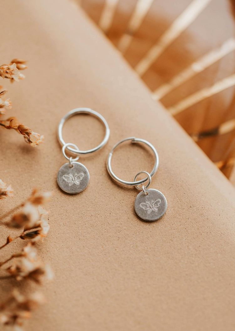 sterling silver butterfly charm earrings from hello adorn