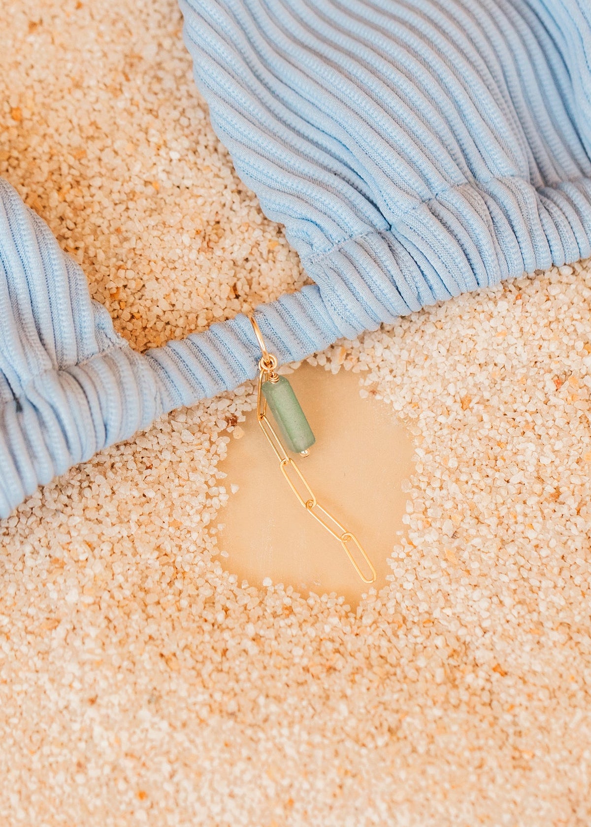 Close-up of blue bikini with a hello adorn bikini charm