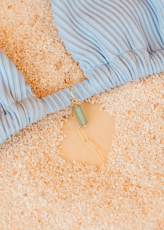 Close-up of blue bikini with a hello adorn bikini charm