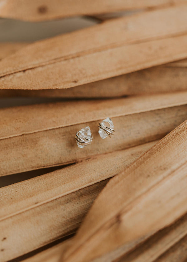 Sterling silver studs using herkimer diamonds wrapped in wire by Hello Adorn.