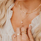 14K Gold Fill Rosalie Necklace by Hello Adorn - pink stone pendant layered with coin chain worn on model's chest