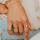 14K Gold Fill Rosalie Ring by Hello Adorn - worn on model's finger with gold initial band and chain bracelets