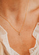 14K Gold Fill Grace Necklace by Hello Adorn - tiny CZ star pendant on delicate chain worn on model's chest