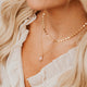 14K Gold Fill Rosalie Necklace by Hello Adorn - worn on smiling model layered with coin chain necklace