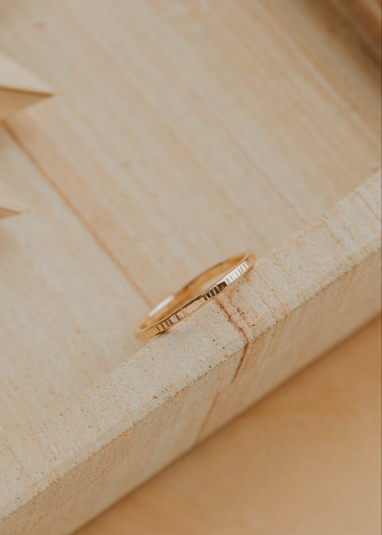 Gold ring on a wooden surface