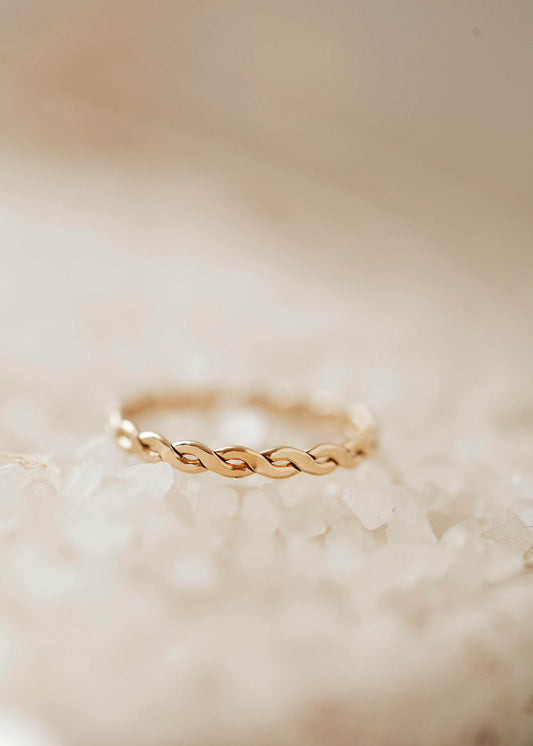 A braided ring created by Hello Adorn to wear as a stacking ring in your new ring stack.