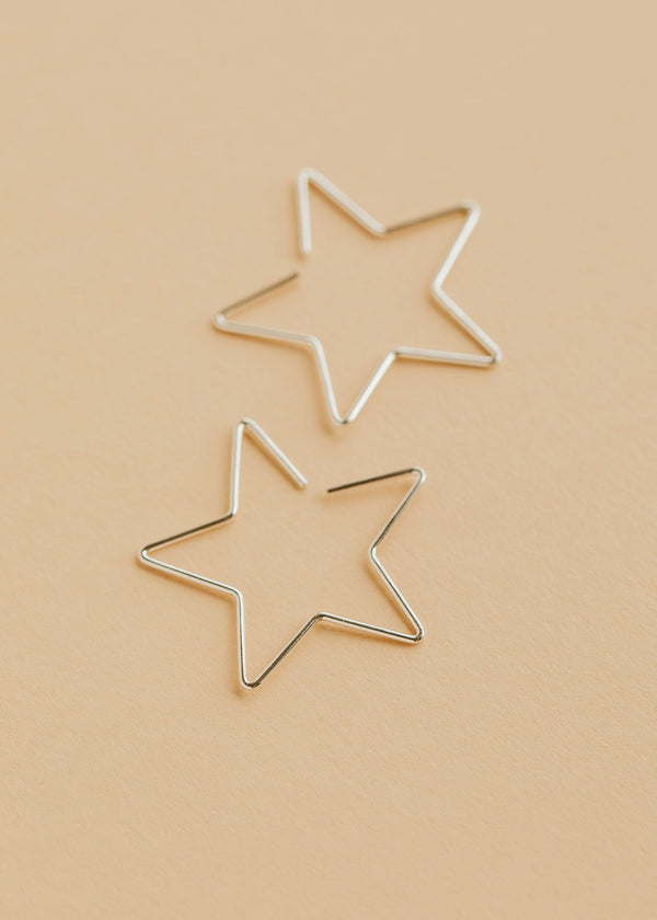 Hello Adorn Star Threader Earrings in Sterling Silver shown flat with a polished background.