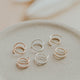 Close-up of Hello Adorn tiny twist earrings