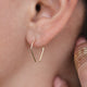 14k gold fill tiny horseshoe threader earrings by Hello Adorn worn on model styled with midi wrap ring
