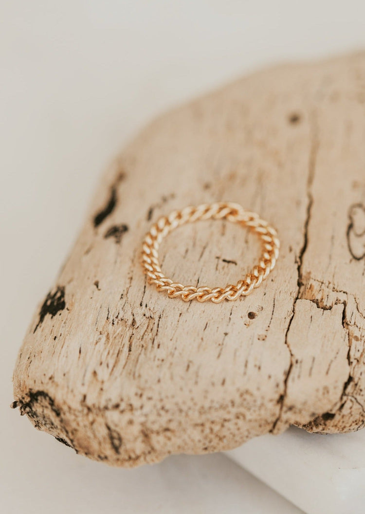 A chain ring shown in 14k gold fill from Hello Adorn inspired by their layering chains, but turned into a stackable ring.