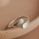A Sterling Silver wrap ring shown in a hammered texture ring perfect if you're looking for an open ring to add to your ring stack by Hello Adorn.