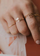 A beautiful ring stack featuring a 14kt Gold Fill wrap cuff ring by Hello Adorn.