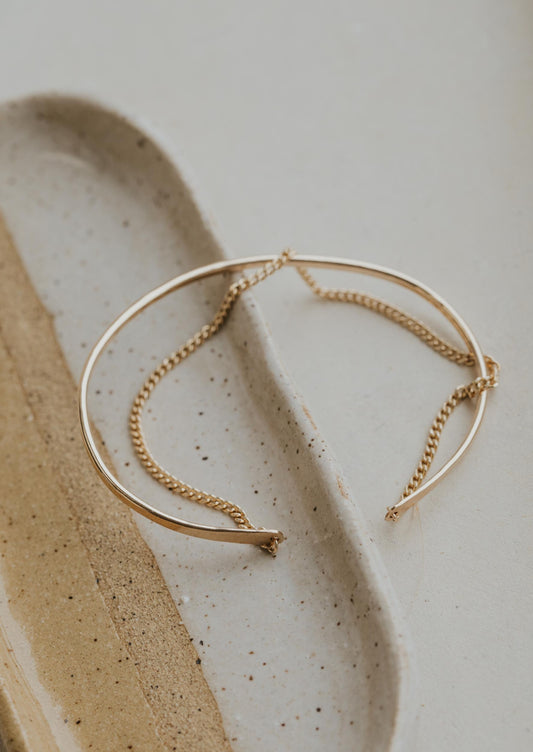 The Tides Cuff created by Hello Adorn, a cuff bracelet stacked to a chain bracelet to give a 2 in 1 bracelet look.