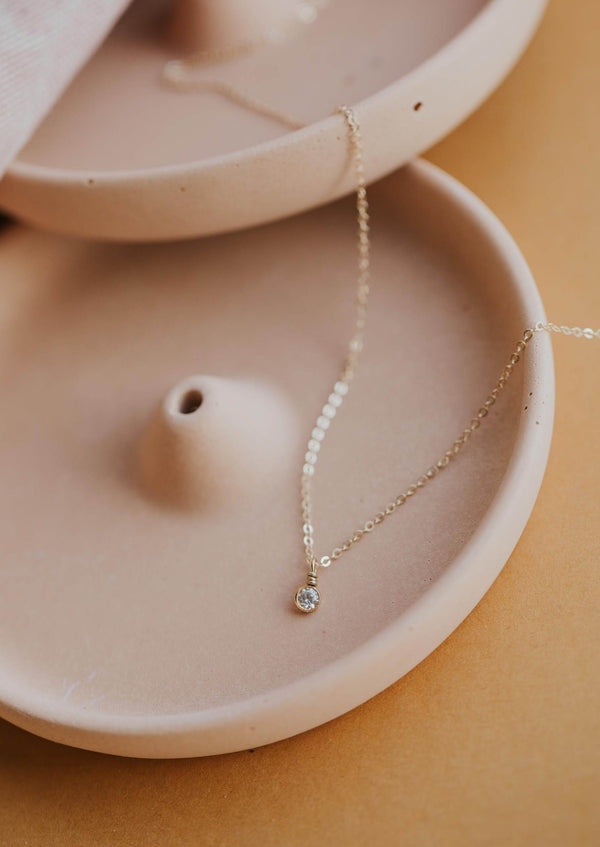 A simple necklace gold design from Hello Adorn, the Solitaire Necklace is a stone necklace in a bezel setting with diamond.