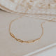 A close look at the Linked Necklace from Hello Adorn, a chain linked necklace with paperclip chains attached to a dainty chain necklace.