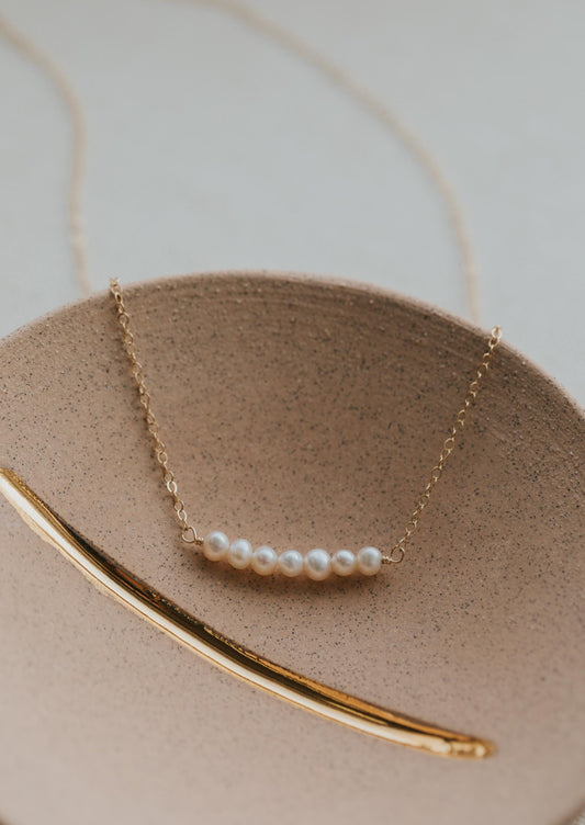A freshwater pearl necklace created by Hello Adorn, choose from 2-7 pearls on your necklace to customize this pearl necklace.