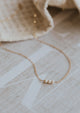 A simple pearl necklace created by Hello Adorn using 2-7 pearls, this necklace features 3 pearls in this custom necklace.