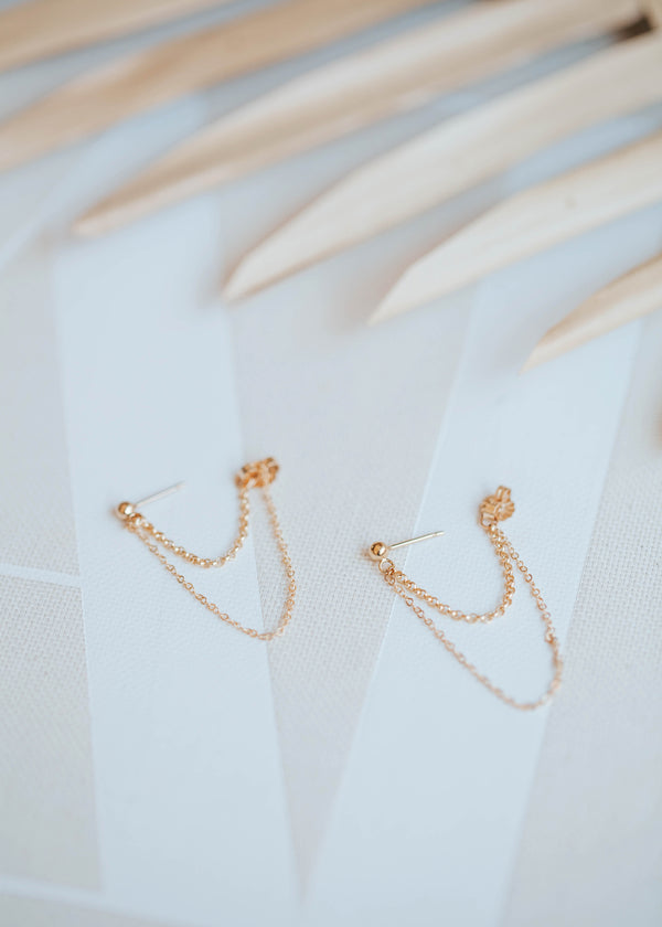 A pair of gold drop earrings created by Hello Adorn from a ball stud earring and double chain earrings combined to create the Skyla Double Annex.