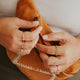 Stackable ring ideas by Hello Adorn, this stack features two hammered rings, a wire wrapped ring, a statement ring as a textured ring, a gold chain ring, a thick chain ring, a handmade ring that was hammered and shaped to create a wave ring, and other gold stacking rings.