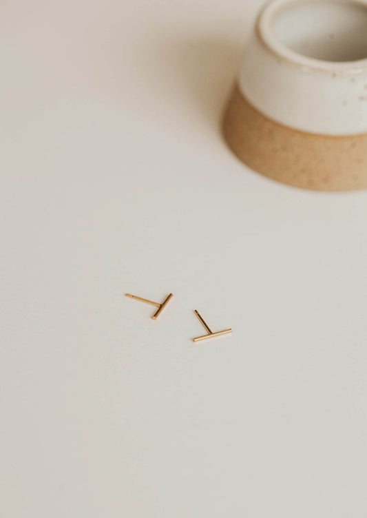 Bar stud earrings by Hello Adorn in 14k gold fill.