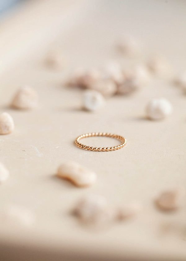 Stacking rings by Hello Adorn in 14k gold fill shown in the beaded ring style, this ring can also be used as a layering ring.