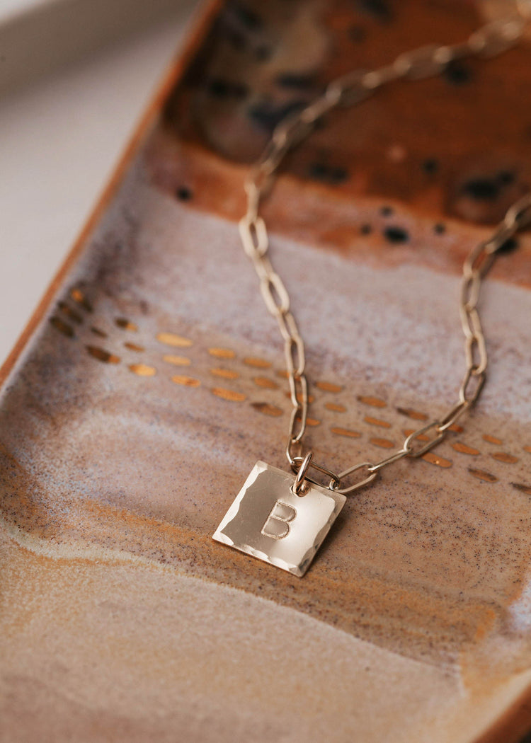 Square pendant necklace stamped with your favorite letter on a chunky chain in 14kt gold fill.