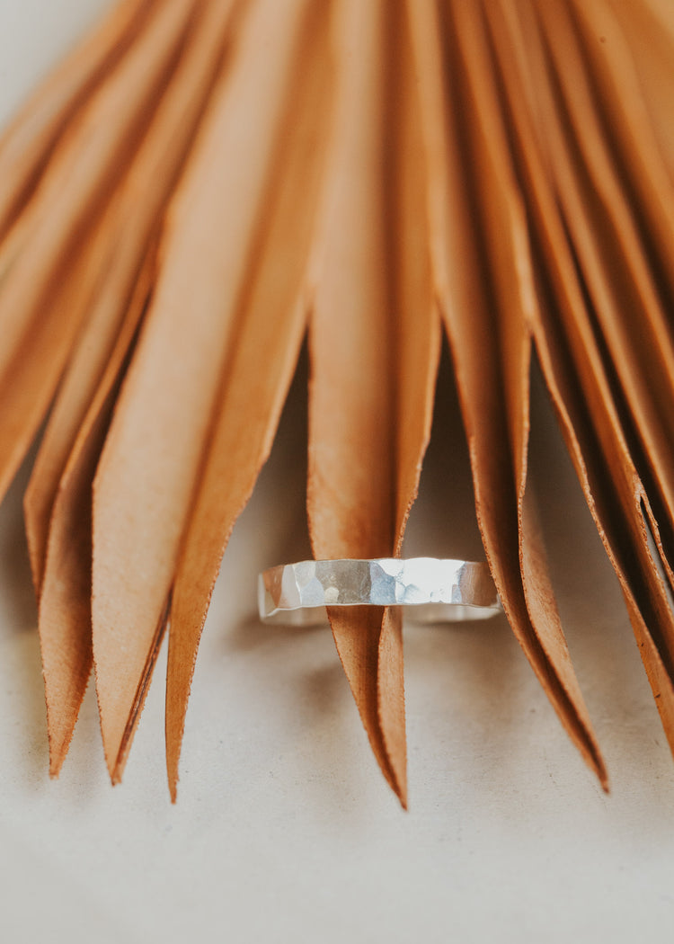 A hammered Sterling Silver statement ring by Hello Adorn in Cigar Band style measuring 3.5 mm thickness.