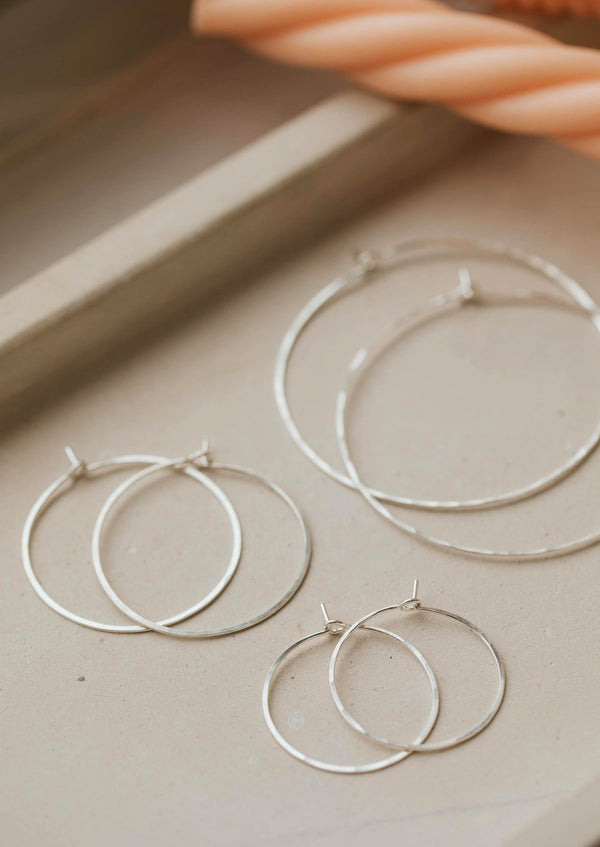 Silver hoop earrings created by Hello Adorn as thin hoop earrings for daily wear earrings in Cypress Hoops style.