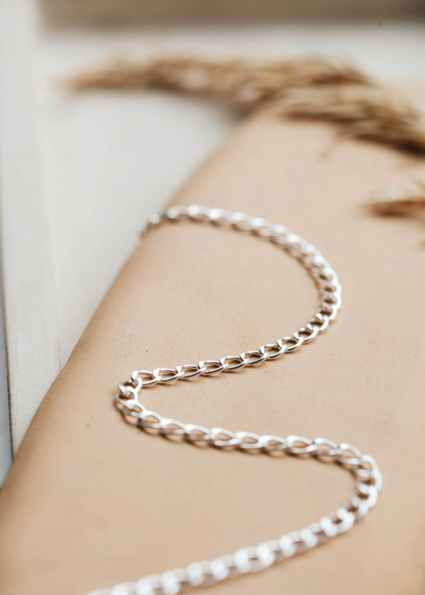 A bold but classic Sterling Silver curb chain necklace.