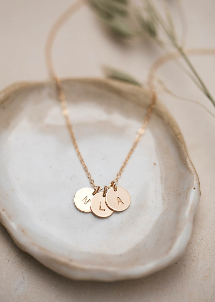 Gold initial necklace with three hand stamped jewelry pendants by Hello Adorn.