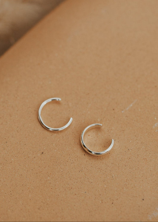 A silver ear cuff pair for people looking for earrings for no piercings, Hello Adorn created this Ear Cuff Duo that includes a thin ear cuff duo and a thick ear cuff duo.