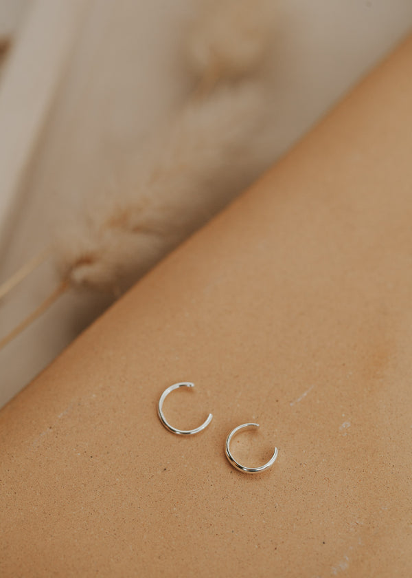 A silver ear cuff pair for people looking for earrings for no piercings, Hello Adorn created this Ear Cuff Duo that includes a thin ear cuff duo and a thick ear cuff duo.