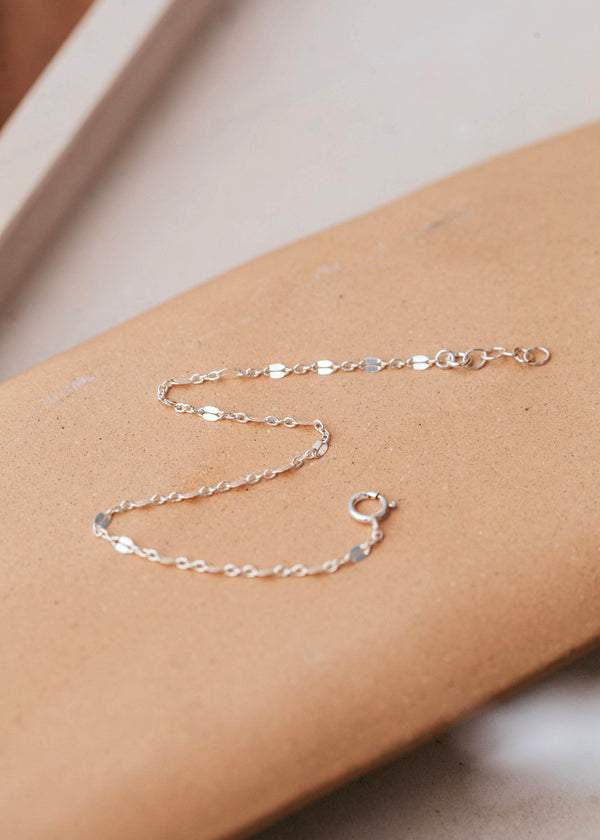 A Sterling Silver chain bracelet featuring a lace pattern design.