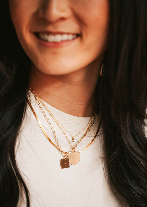 14kt Gold Fill layered necklaces featuring a custom square initial pendant charm.